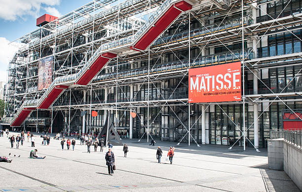 Pompidou Centre in Paris, France Paris, France - May 12, 2012: front facade of Centre George Pompidou, designed by architects Renzo Piano and Richard Rogers. Today it hosts one of the most important museum of Modern Arts and a huge art library. It is named after George Pompidou, resident of france from 1969 to 1974. pompidou center stock pictures, royalty-free photos & images