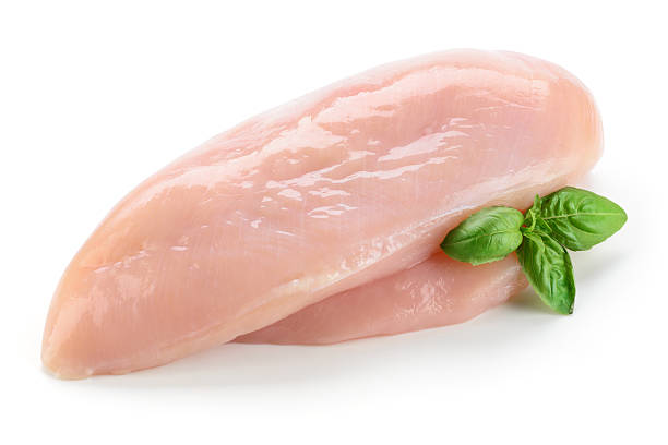 istock Raw chicken fillet with basil isolated on white 495113580
