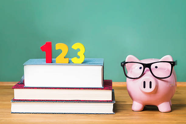 istock School with pink piggy bank with chalkboard 495114414