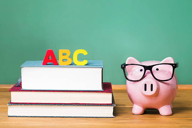 istock School theme with ABCs and pink piggy bank 495114422