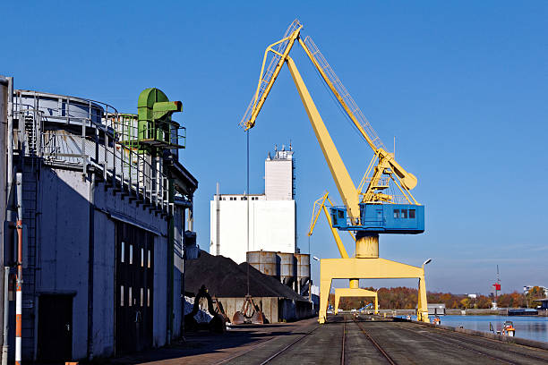 freight harbor scene canal harbor scene with crane; Nuremberg, Germany level luffing crane stock pictures, royalty-free photos & images