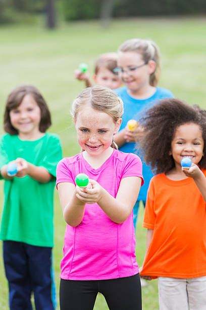 istock Multiracial group of children in an egg spoon race 495117436