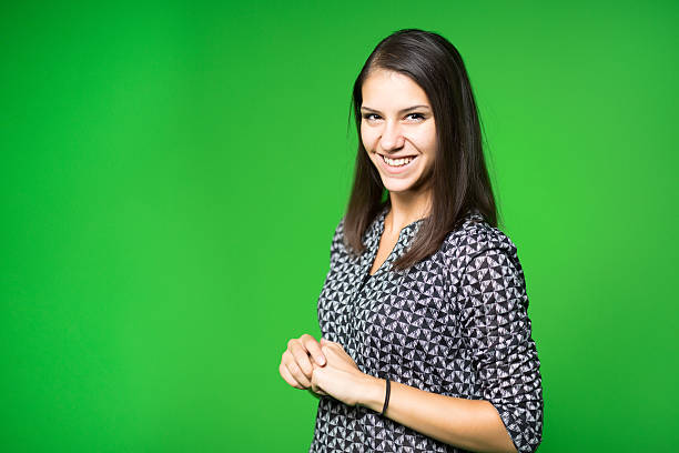 Television presenter recording in a green screen studio stock photo