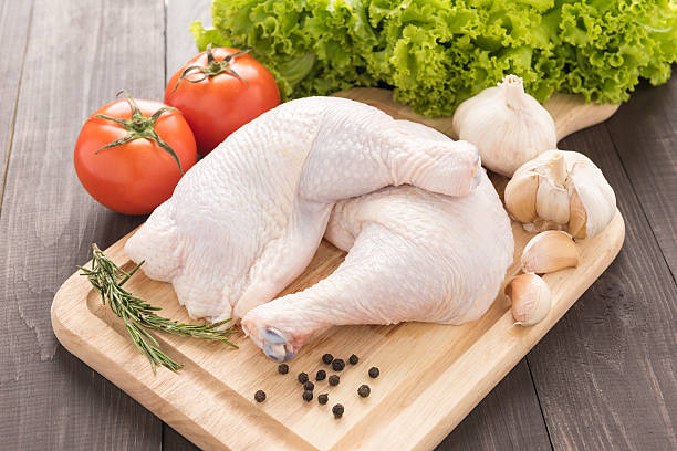 istock Ingredients and raw chicken leg on cutting board 495122884