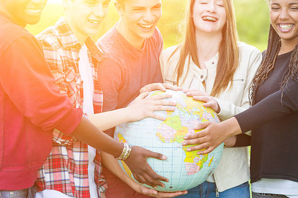 istock Group of Teenagers Holding World Globe Map 495144269