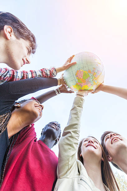 istock Group of Teenagers Holding World Globe Map 495144271