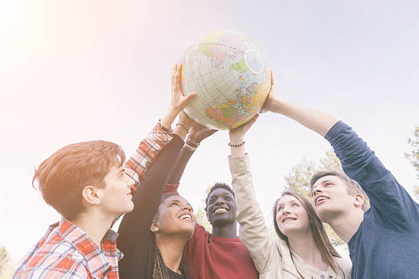 istock Group of Teenagers Holding World Globe Map 495144273