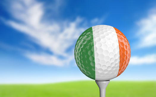 Close-up of a golf ball with the flag of Ireland realistically rendered in 3D.