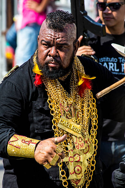 Barranquilla, Colombia - March 1, 2014: Barranquilla, Colombia - March 1, 2014 - Performers in elaborate costume sing, dance, and stroll their way down the streets of Barranquilla during the Battalla de Flores. The Pinnacle of the Carnival de Barranquilla parades.