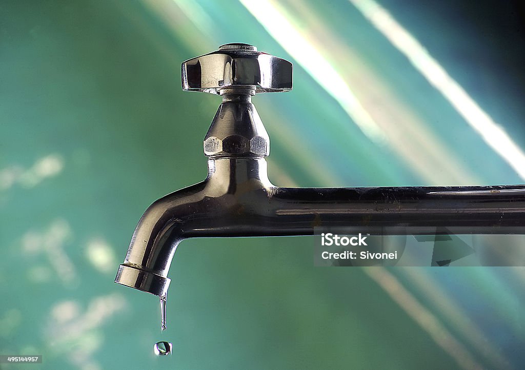 Waste of water resources Leaky faucet and water drop falling Water Stock Photo