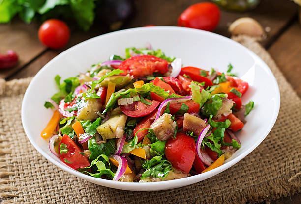 istock Salad baked eggplant and fresh tomatoes 495145892
