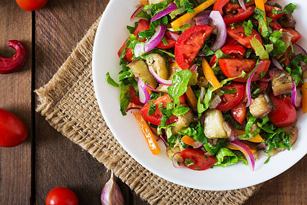 istock Salad baked eggplant and fresh tomatoes 495146116