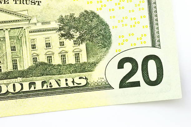 istock macro close up bills of twenty dollars isolated on white 495147979