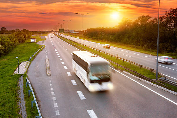 istock White bus in the rush hour on highway 495148257