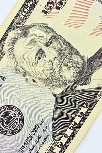 istock macro shot with fifty dollar bill isolated on white background 495148631