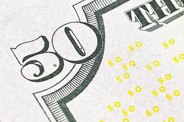 istock macro close up shot with fifty dollar bill 495148727
