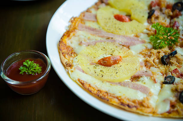 istock Homemade Pizza,half salmon and half Hawaiian. 495149601