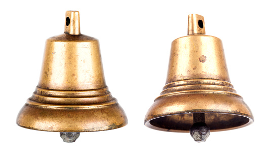 Bronze metal bell isolated on white background closeup