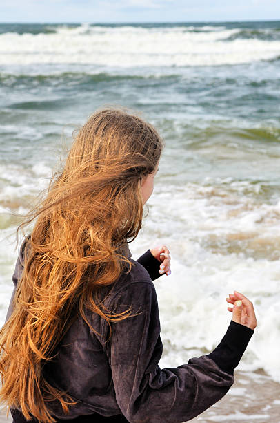 istock Young girl at the sea 495173024