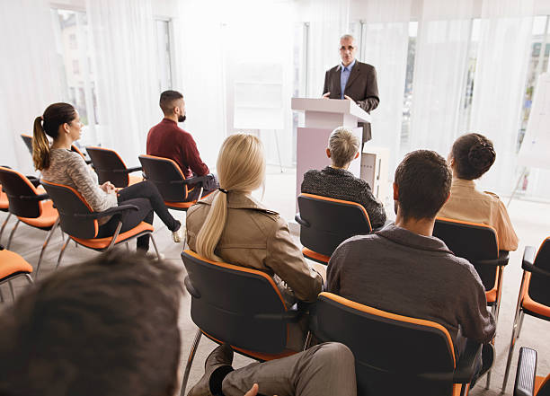 istock Large group of business people attending a seminar. 495173048