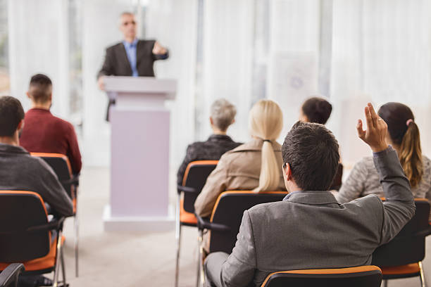 istock Back view of a businessman asking a question on seminar. 495173128