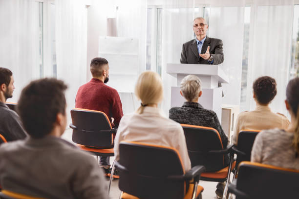 istock Senior businessman giving a speech on a conference. 495173220