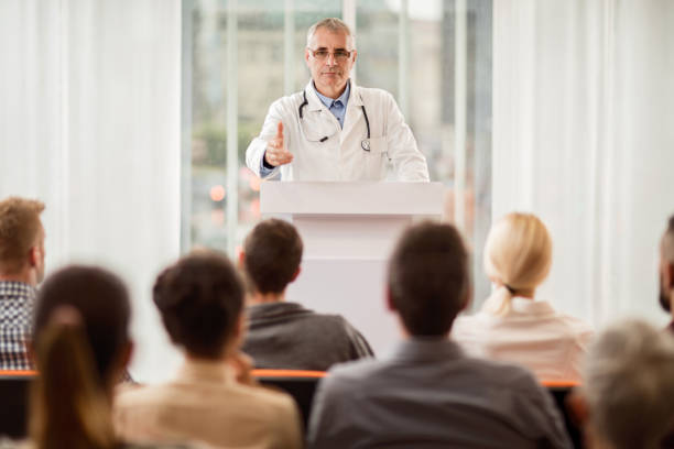 istock Senior doctor giving a speech on education event. 495173726
