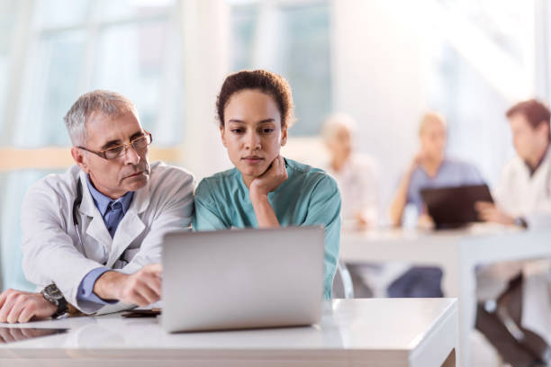 istock Two healthcare workers working together on a laptop. 495174800