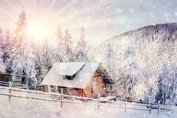 istock chalets in the mountains at sunset. Winter greetings 495175448
