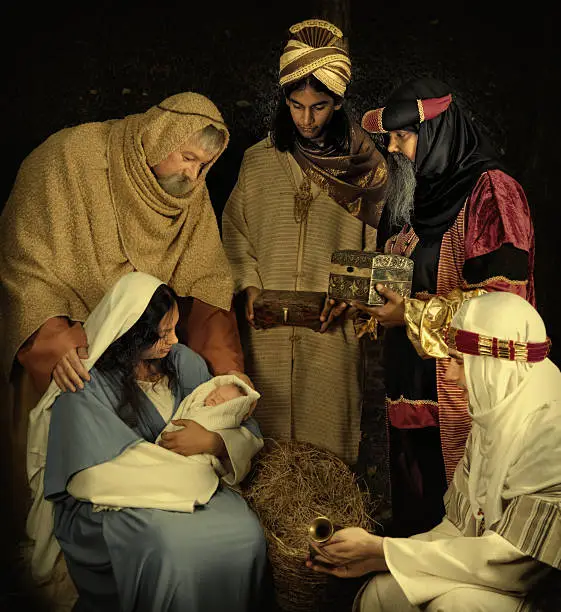 Live Christmas nativity scene reenacted in a medieval barn