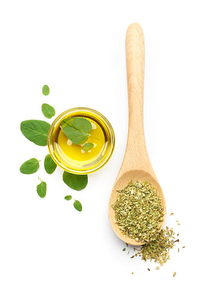Oregano Leaves, Dried Oregano and Olive Oil Oregano leaves, dried oregano and olive oil on white background oregano stock pictures, royalty-free photos & images
