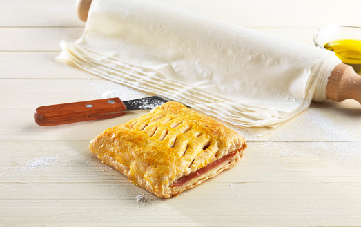 homemade ham and cheese pie and pastry phyllo on a kitchen table