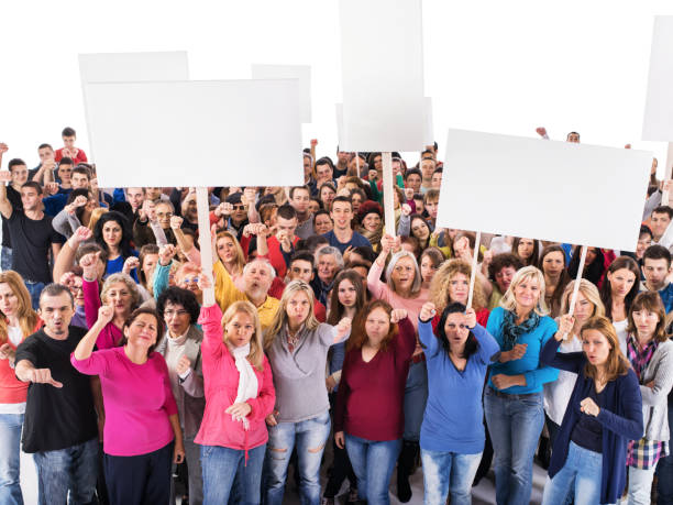 istock Large group of displeased people holding white banners. 495185840