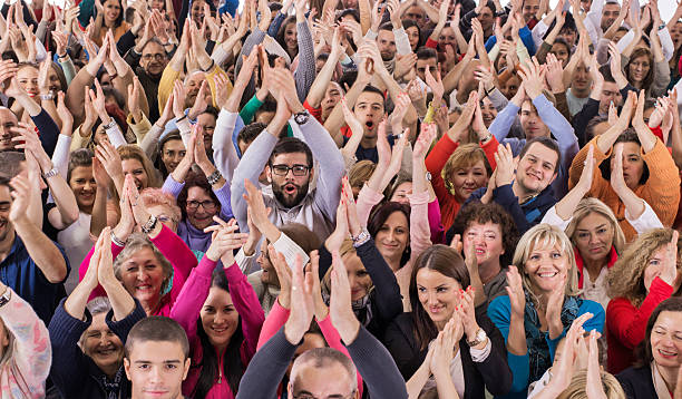 istock Large group of happy people applauding. 495185908