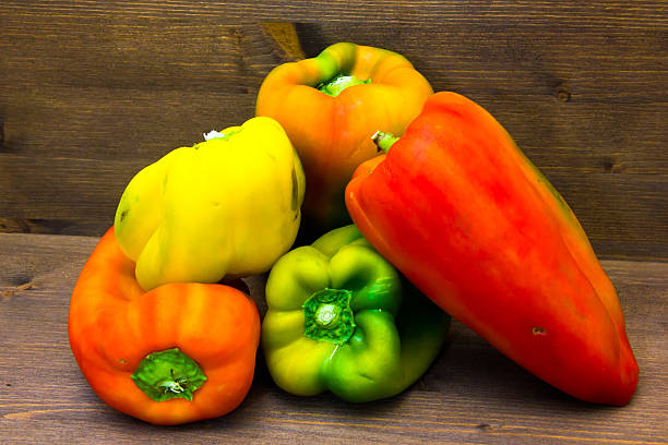 istock Lots of peppers on wood 495187993