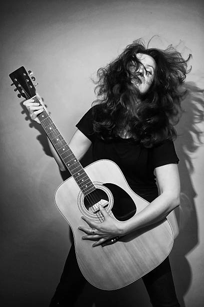 istock Woman with rock guitar 495188459