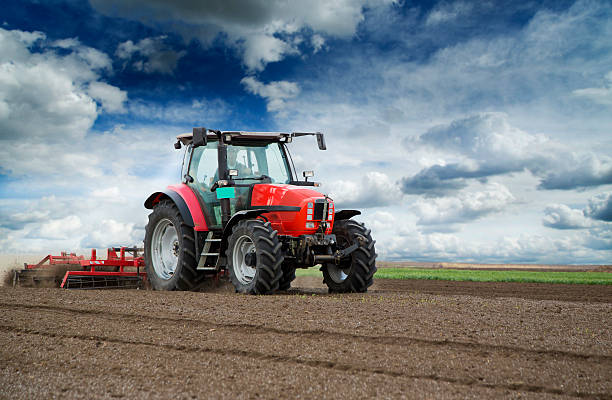 istock Preparing land for sowing at spring, farmer in tractor 495188947