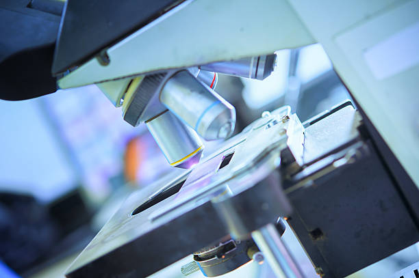 istock close up of microscope lens in laboratory hospital 495189584