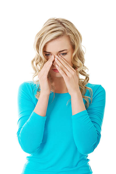 istock Woman with sinus pressure pain 495189785