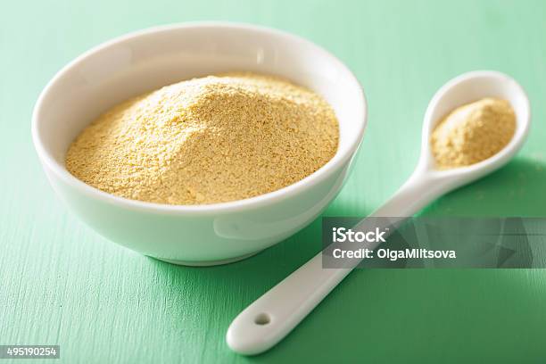 Vegan Nutritional Yeast Flakes In Bowl Stock Photo - Download Image Now - Yeast, Green Color, 2015