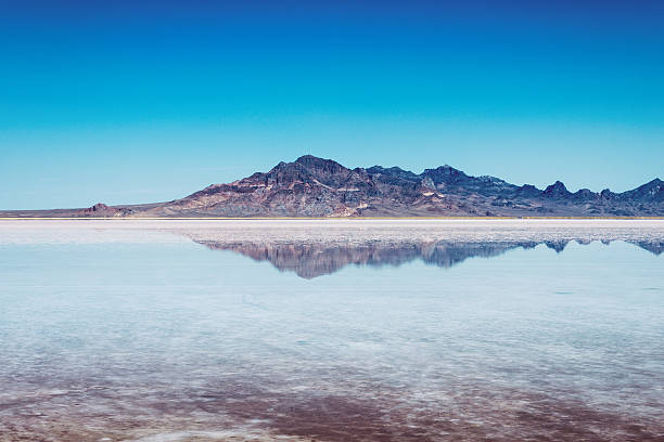 Mountains over a salt lake, reflection