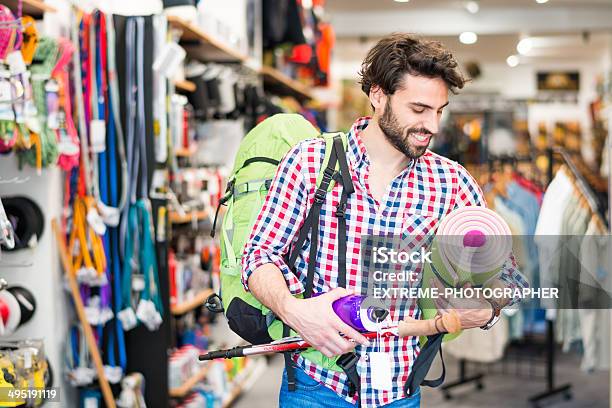 Man Shopping Camping Equipment Stock Photo - Download Image Now - Adult, Backpack, Casual Clothing