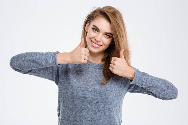 istock Smiling woman showing thumbs up 495191162