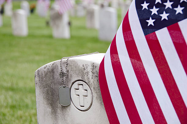 istock military dog tags on veteran's tombstone 495191793