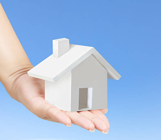 istock holding house representing home ownership 495191831