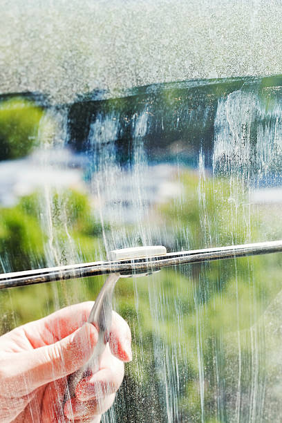 istock cleaning of home window glass by squeegee 495193585