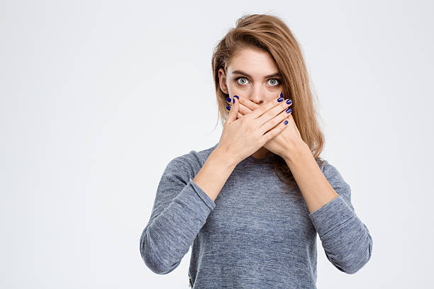 istock Woman covering her mouth with palms 495198770