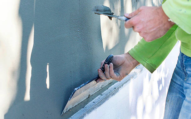 istock The process of putty walls with foam plastic 495199686