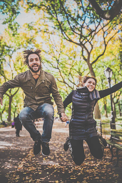 istock Young Couple Jumping in Central Park, NYC 495200412