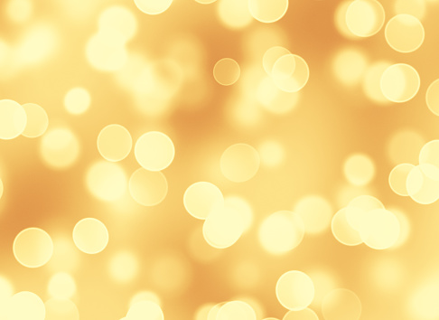 Abstract golden lights particles bokeh background